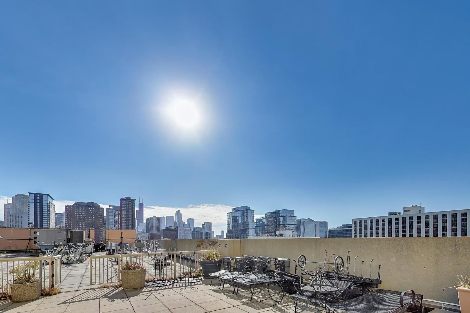 111 West Maple Street, Unit 1503 Chicago, IL 60610 - Photo 38 of 39 a view of a city with tall buildings