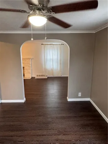 a view of a room with wooden floor