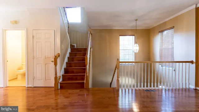 a view of an entryway with wooden floor
