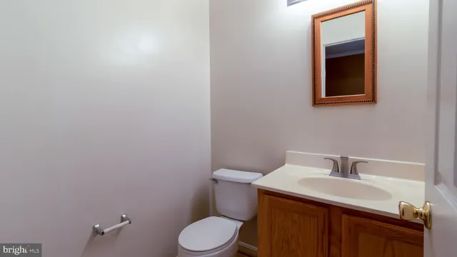 a kitchen with stainless steel appliances granite countertop a refrigerator a stove a sink and a window