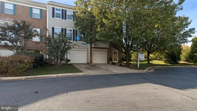 a view of a house with a yard and garage