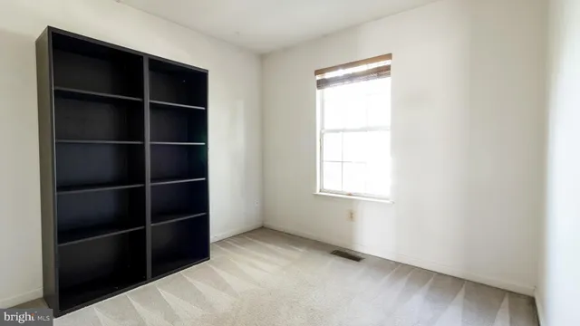 a view of closet area with empty racks