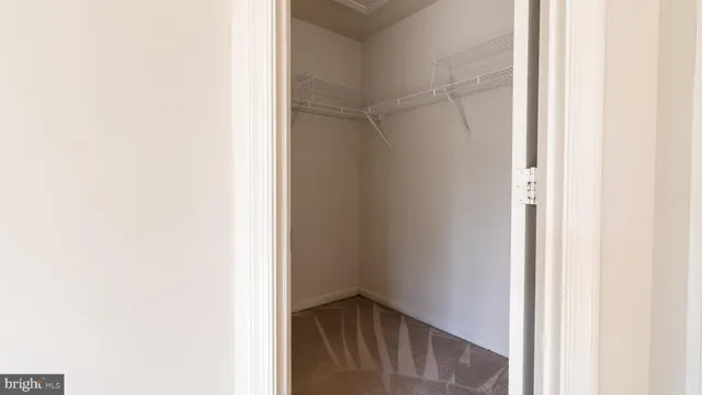 a view of a house with a wooden deck and a yard