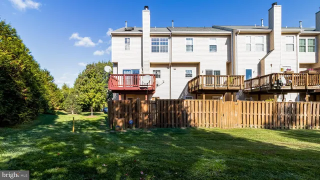 a view of a house with wooden deck