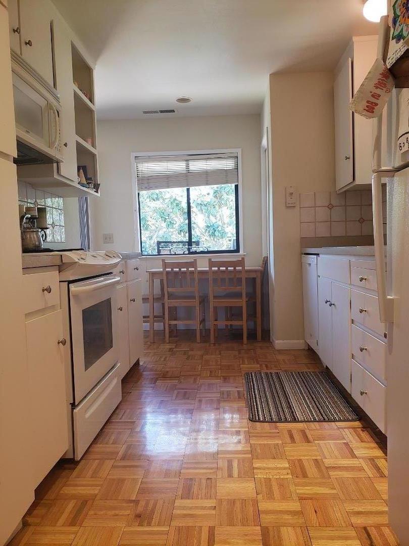 9500 Center Street, Unit 19 Carmel, CA 93923 - Photo 3 of 12 a kitchen with sink cabinets and window