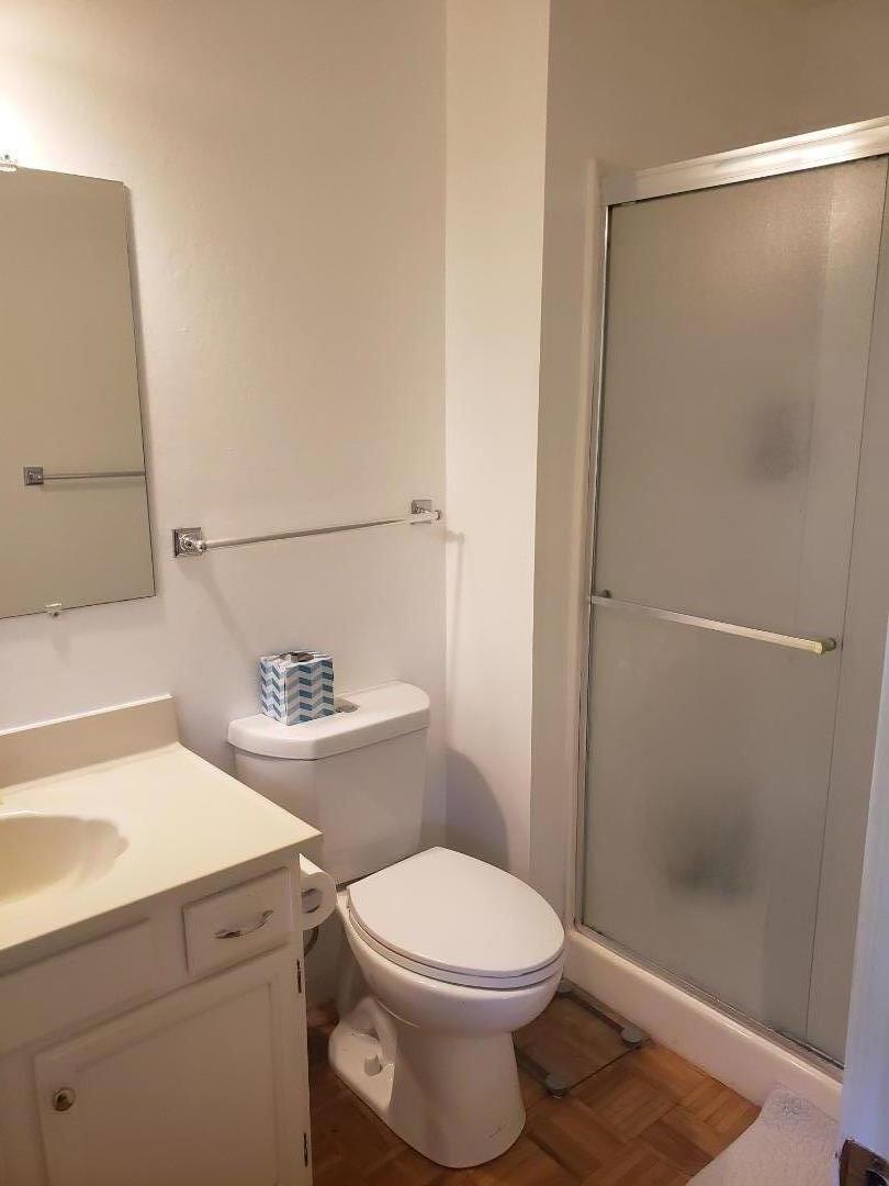 9500 Center Street, Unit 19 Carmel, CA 93923 - Photo 5 of 12 a bathroom with a sink a toilet and shower