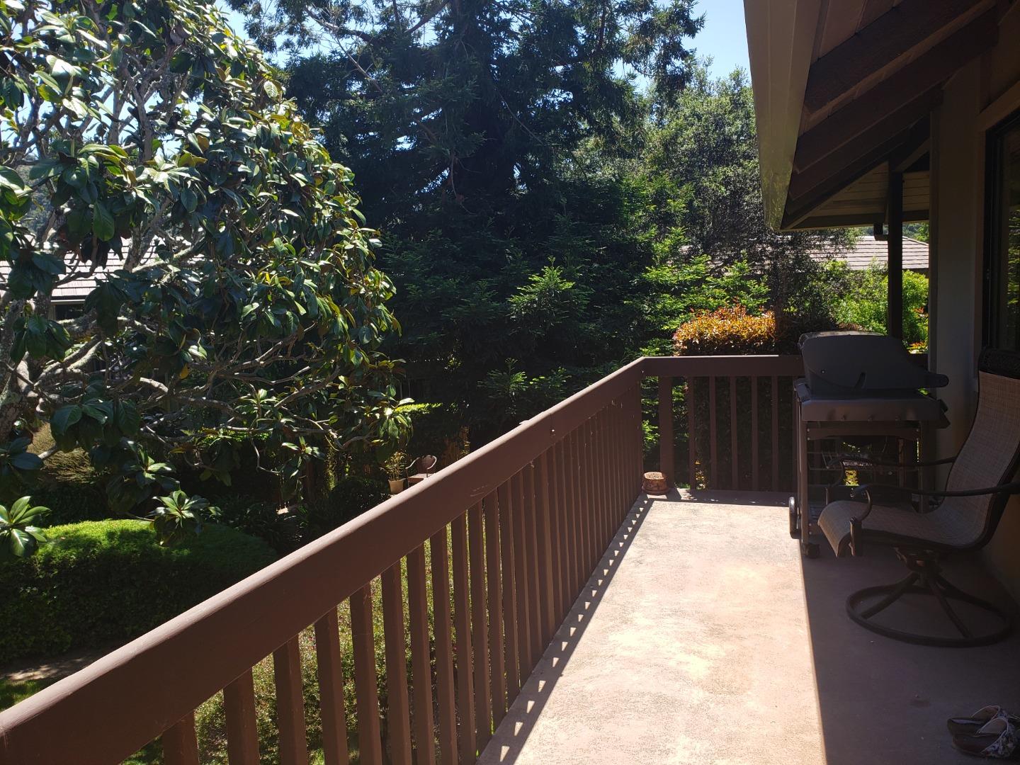 9500 Center Street, Unit 19 Carmel, CA 93923 - Photo 10 of 12 a balcony with wooden floor
