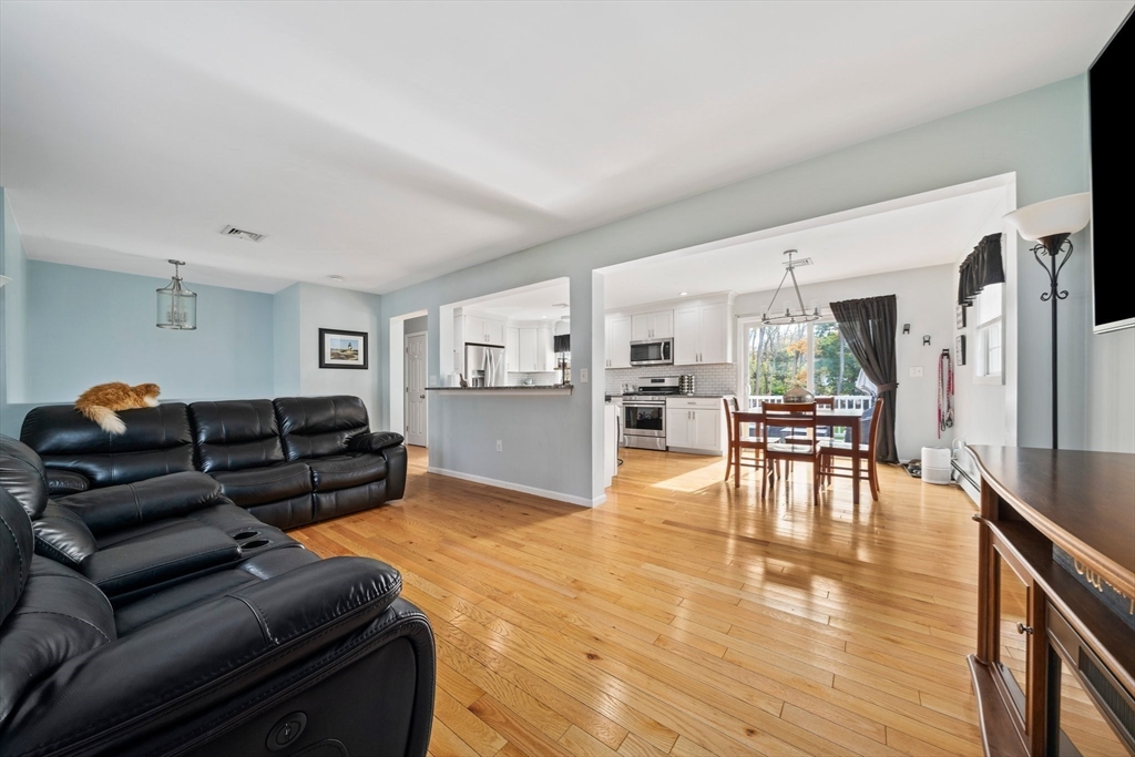 10 Crossman Circle Abington, MA 02351 - Photo 11 of 38 a living room with furniture and a wooden floor