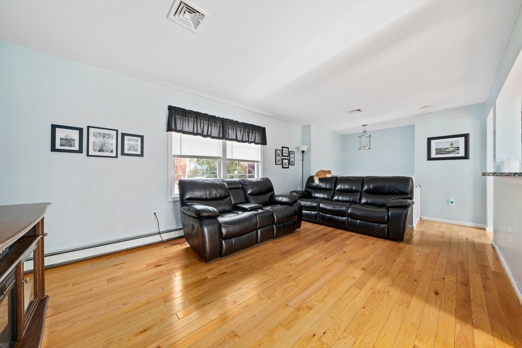 10 Crossman Circle Abington, MA 02351 - Photo 13 of 38 a living room with furniture and a flat screen tv