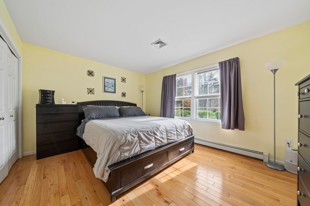 10 Crossman Circle Abington, MA 02351 - Photo 14 of 38 a bedroom with a bed and window