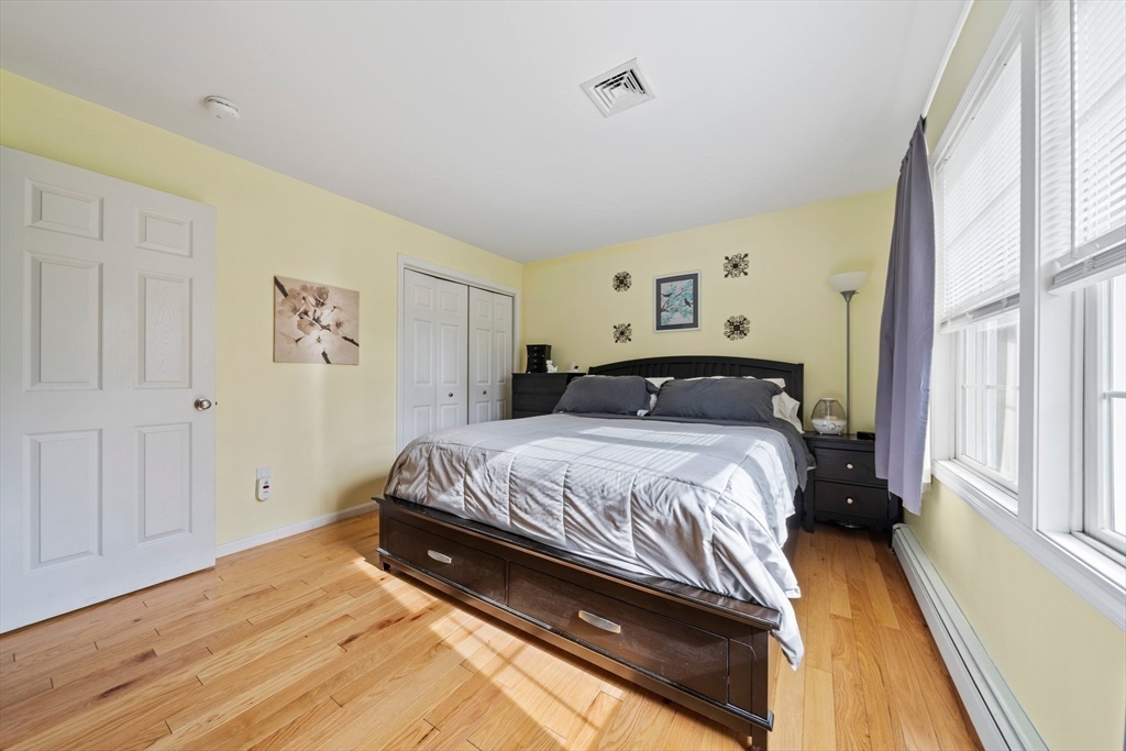 10 Crossman Circle Abington, MA 02351 - Photo 15 of 38 a bedroom with a bed and a window