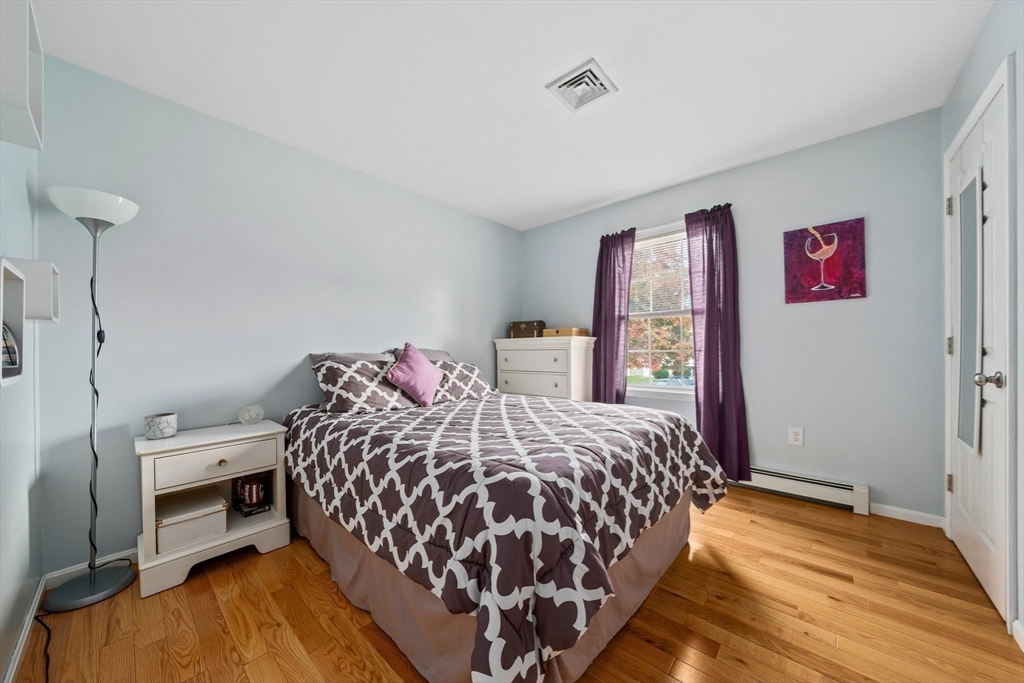 10 Crossman Circle Abington, MA 02351 - Photo 18 of 38 a bedroom with a bed and a dresser