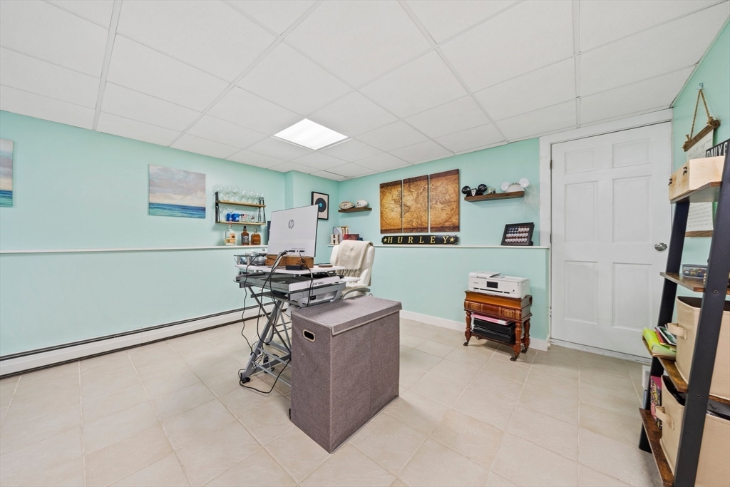 10 Crossman Circle Abington, MA 02351 - Photo 25 of 38 a work room with furniture and a flat screen tv