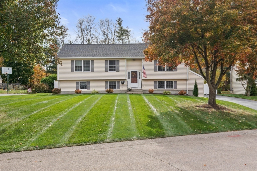 10 Crossman Circle Abington, MA 02351 - Photo 30 of 38 a view of a white house with a big yard and large trees