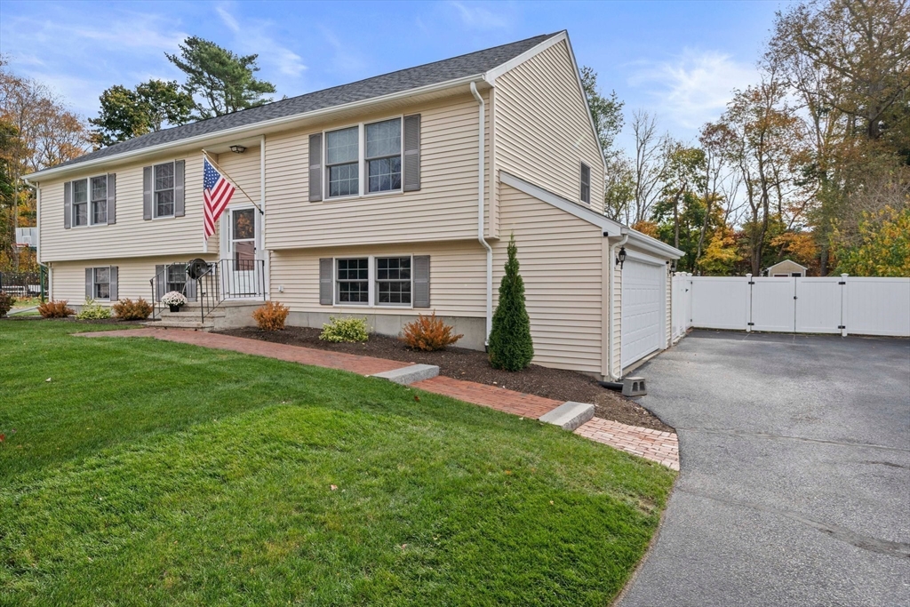10 Crossman Circle Abington, MA 02351 - Photo 3 of 38 a view of a yard in front of a house