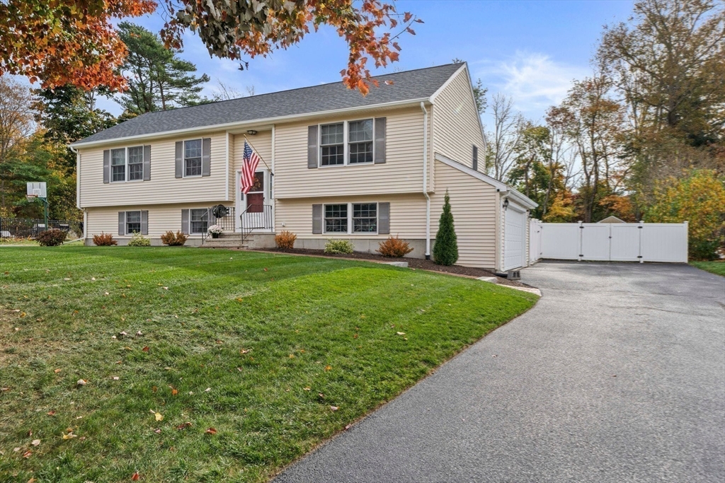 10 Crossman Circle Abington, MA 02351 - Photo 31 of 38 a front view of house with yard and green space