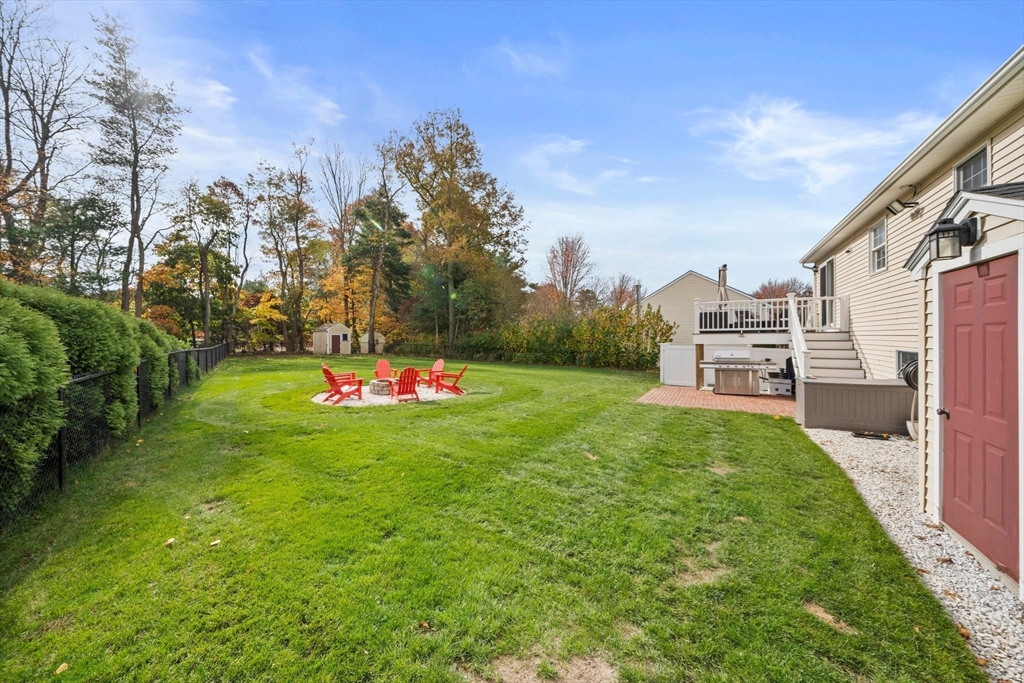 10 Crossman Circle Abington, MA 02351 - Photo 34 of 38 a backyard of a house with table and chairs