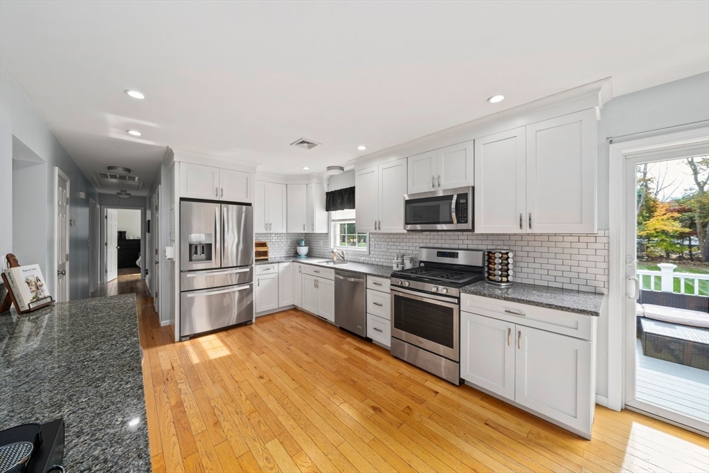 10 Crossman Circle Abington, MA 02351 - Photo 4 of 38 a kitchen with stainless steel appliances a refrigerator sink and microwave