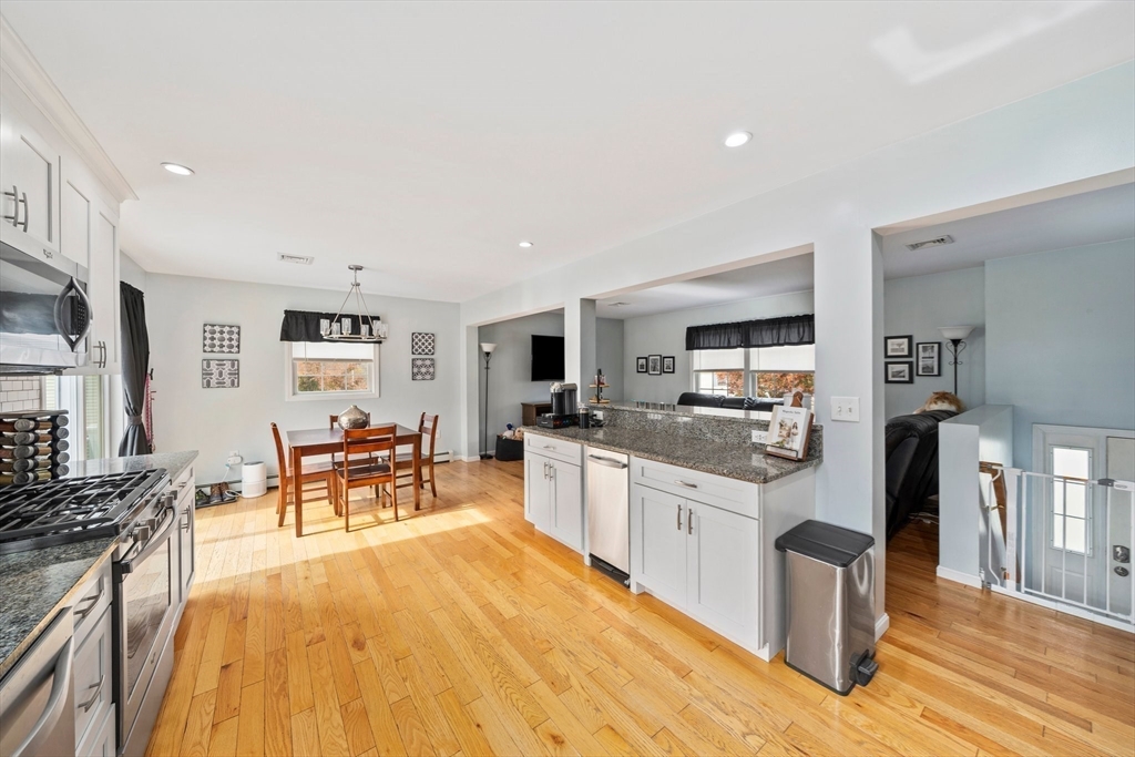 10 Crossman Circle Abington, MA 02351 - Photo 5 of 38 a large kitchen with stainless steel appliances kitchen island granite countertop a large counter top space and stainless steel appliances