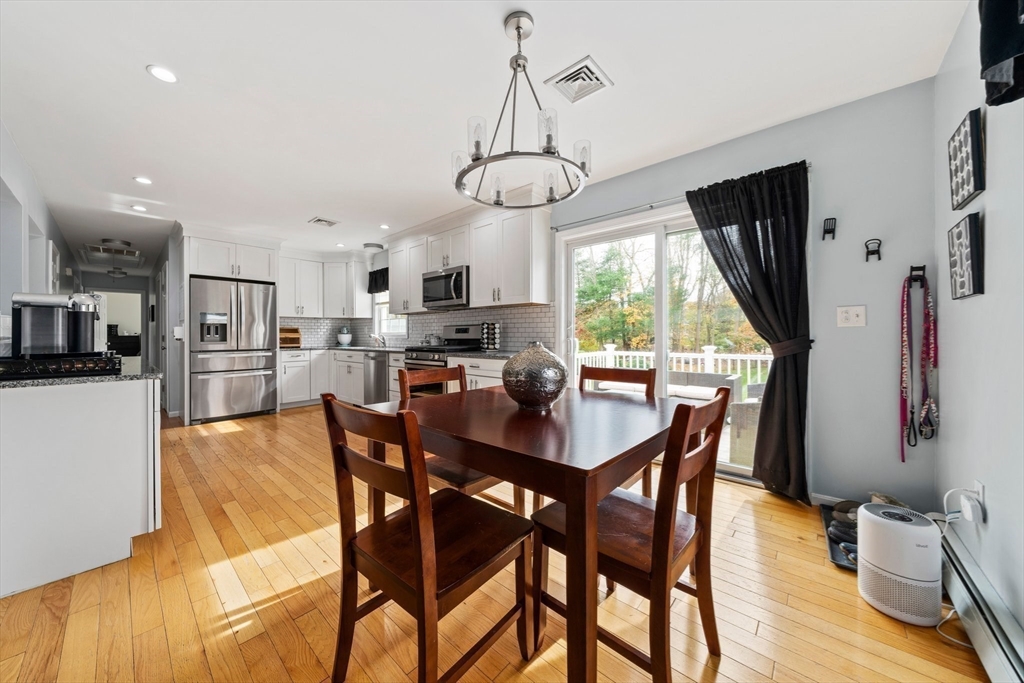 10 Crossman Circle Abington, MA 02351 - Photo 8 of 38 a view of a dining room with furniture window and wooden floor