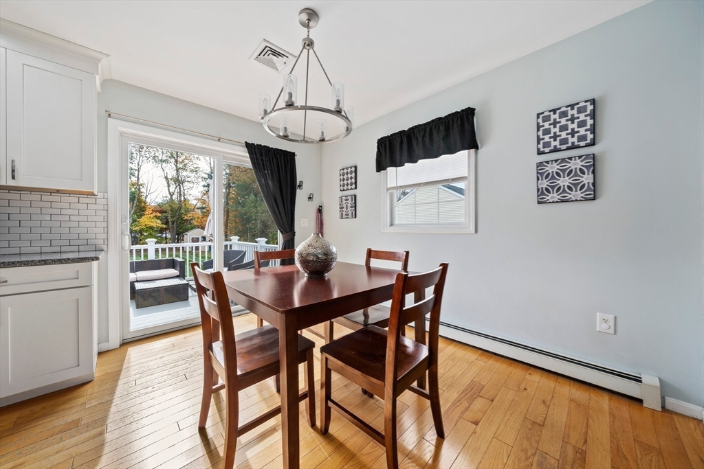 10 Crossman Circle Abington, MA 02351 - Photo 10 of 38 a view of a dining room with furniture window and wooden floor