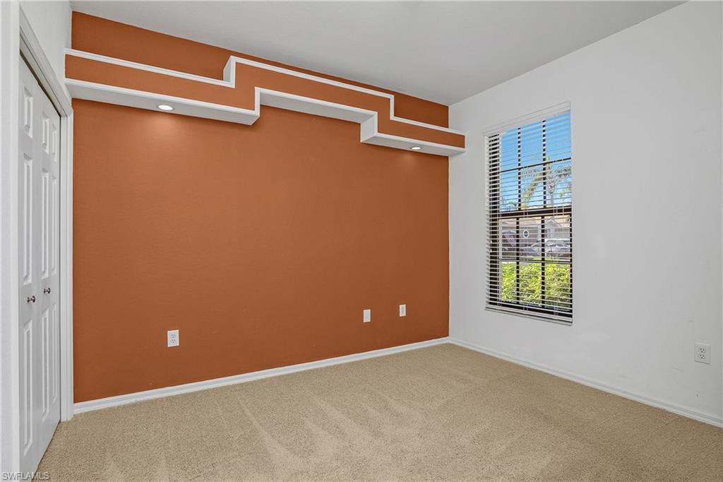 7820 Sandpine Court, Unit 2304 Naples, FL 34104 - Photo 23 of 49 a view of an empty room with a window