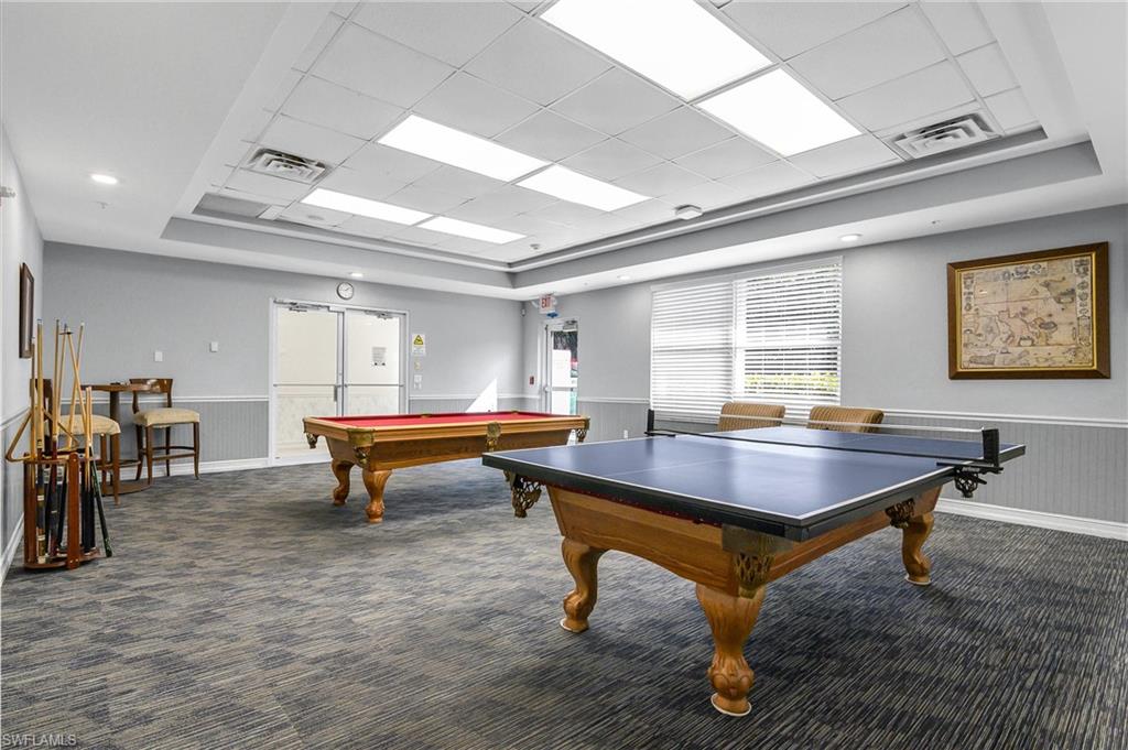 7820 Sandpine Court, Unit 2304 Naples, FL 34104 - Photo 40 of 49 a room with furniture pool table and windows