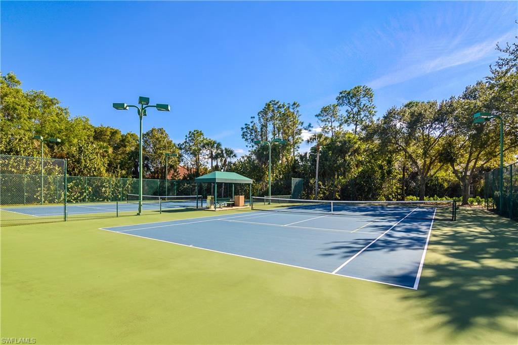 7820 Sandpine Court, Unit 2304 Naples, FL 34104 - Photo 45 of 49 a view of a swimming pool with an outdoor space and seating area