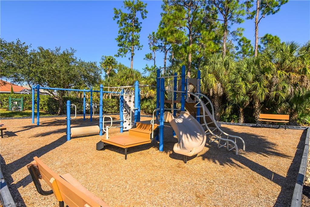 7820 Sandpine Court, Unit 2304 Naples, FL 34104 - Photo 46 of 49 swimming pool with outdoor seating and trees in the background