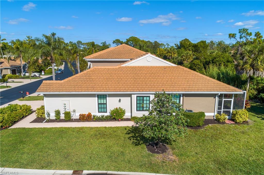 7820 Sandpine Court, Unit 2304 Naples, FL 34104 - Photo 49 of 49 a view of a house with a yard