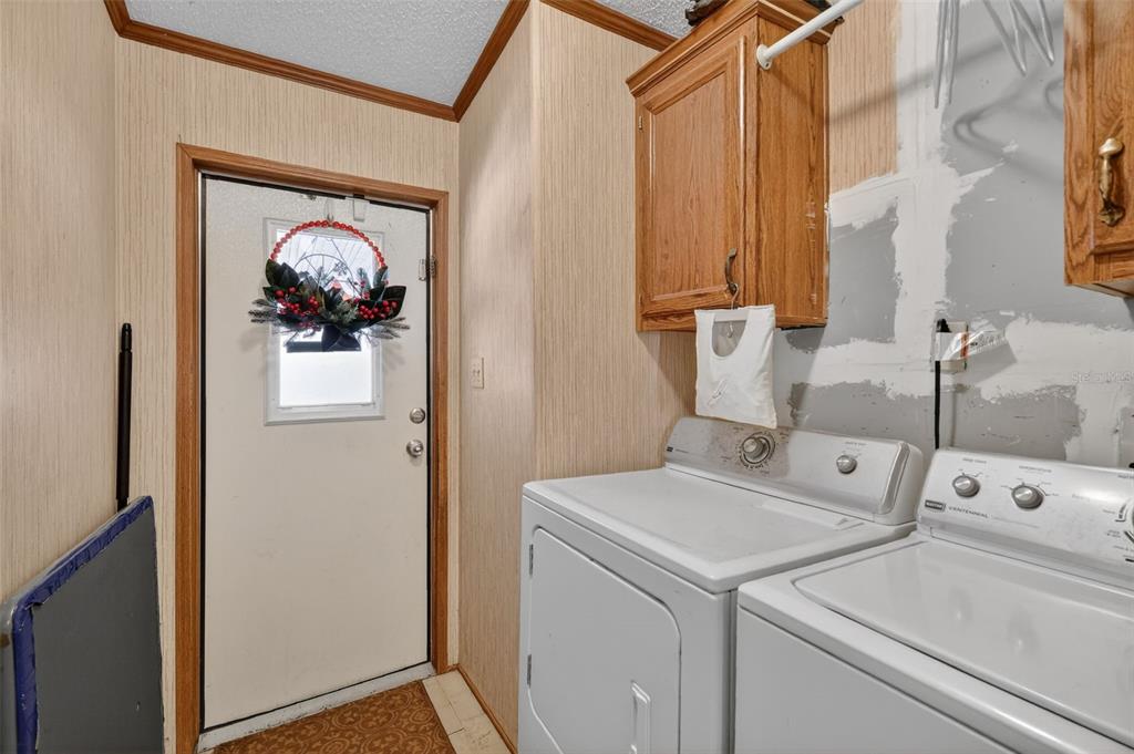 11911 Lane Park Road Tavares, FL 32778 - Photo 19 of 30 a utility room with dryer and washer