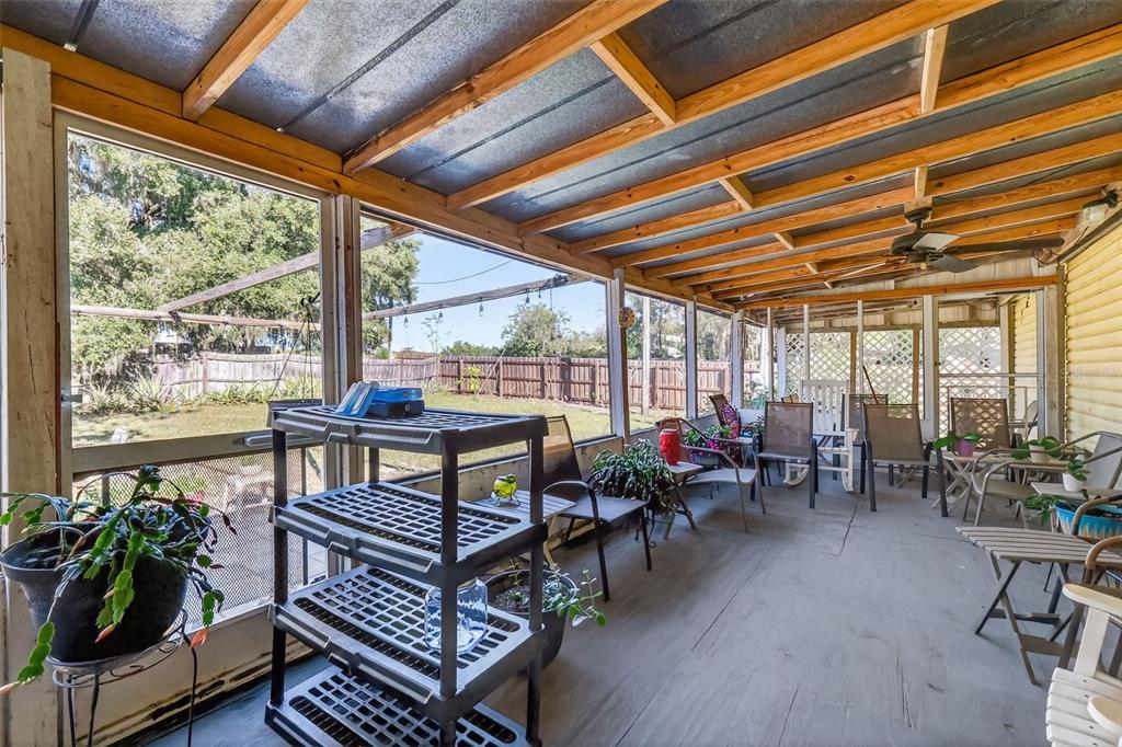 11911 Lane Park Road Tavares, FL 32778 - Photo 20 of 30 a living room with furniture a bed and a table