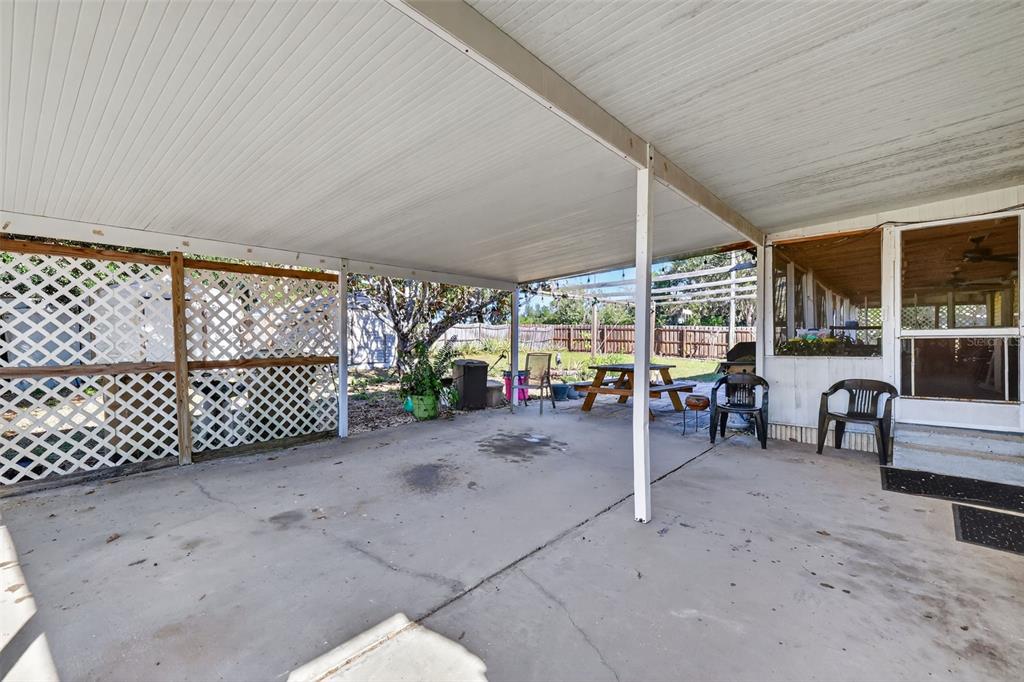 11911 Lane Park Road Tavares, FL 32778 - Photo 22 of 30 a view of a porch patio yard and porch