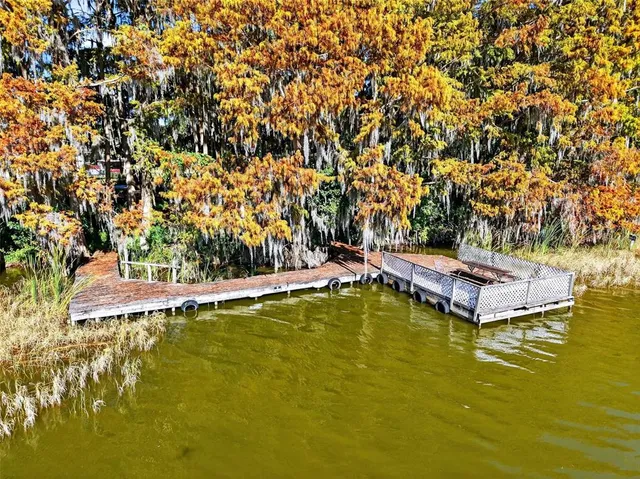 a view of a swimming pool with an outdoor space and seating area