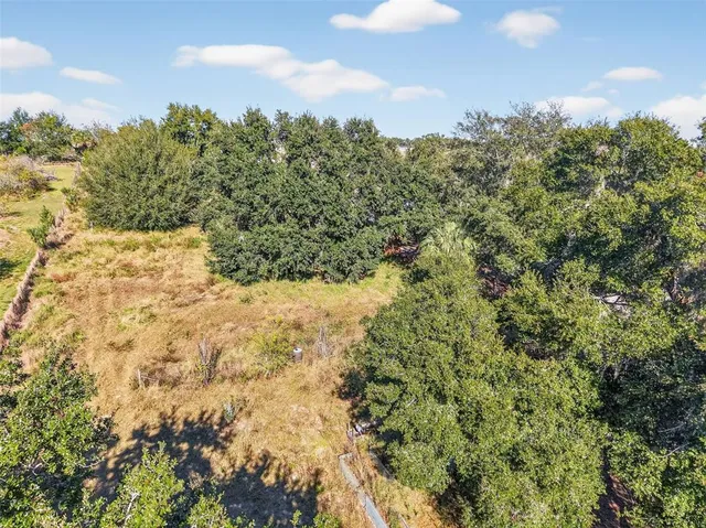 a view of a yard covered with snow in outdoor space