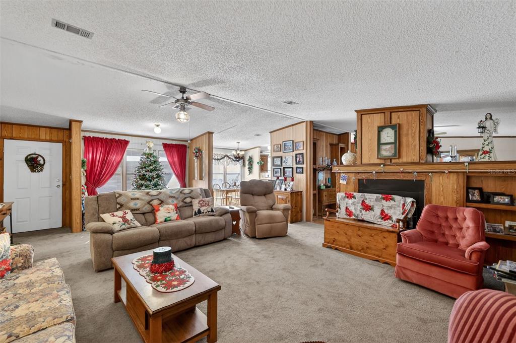 11911 Lane Park Road Tavares, FL 32778 - Photo 5 of 30 a living room with furniture and a large window