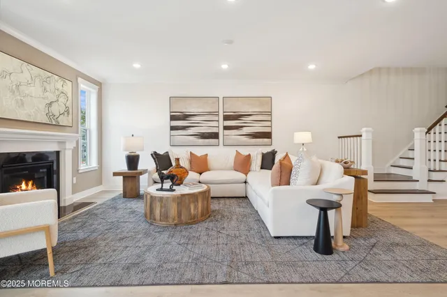 a living room with furniture and a table