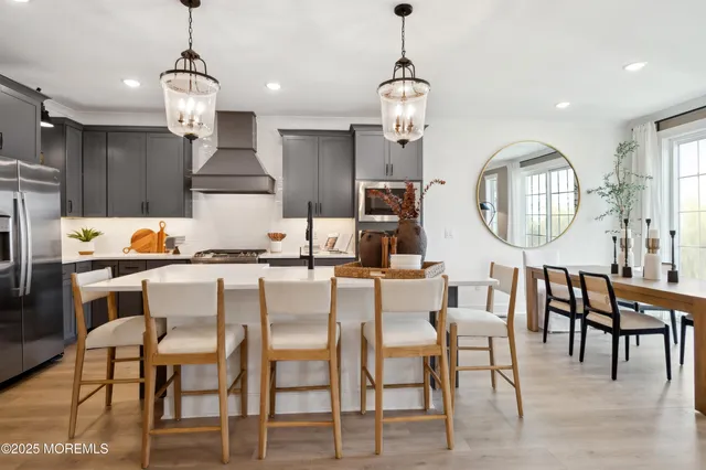 a view of a chair and table in the backyard