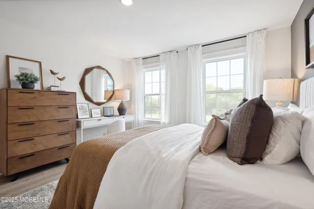 a view of an house with backyard and a tree