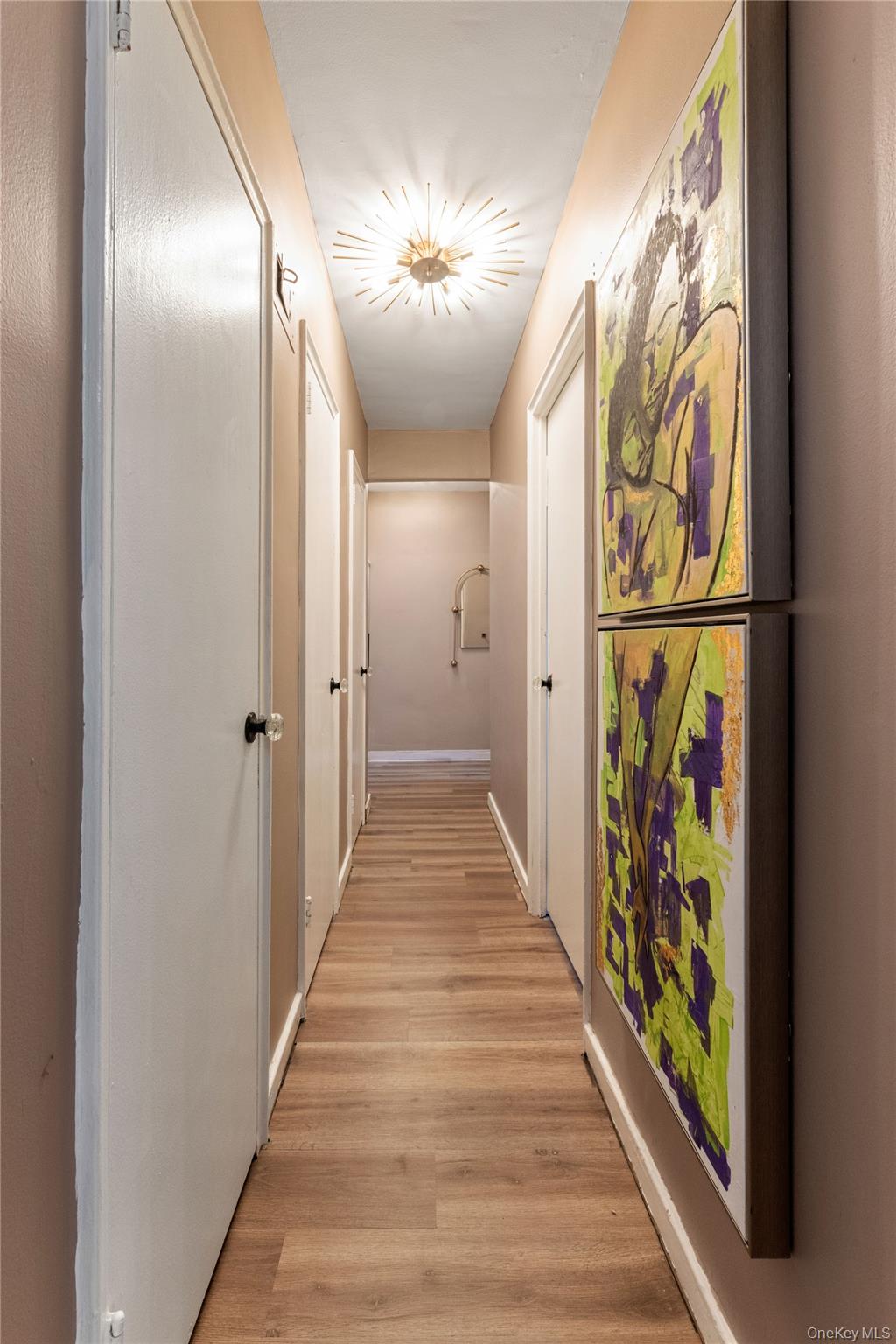 83-33 Austin Street, Unit 3D Queens, NY 11415 - Photo 16 of 20 a view of a hallway with wooden floor