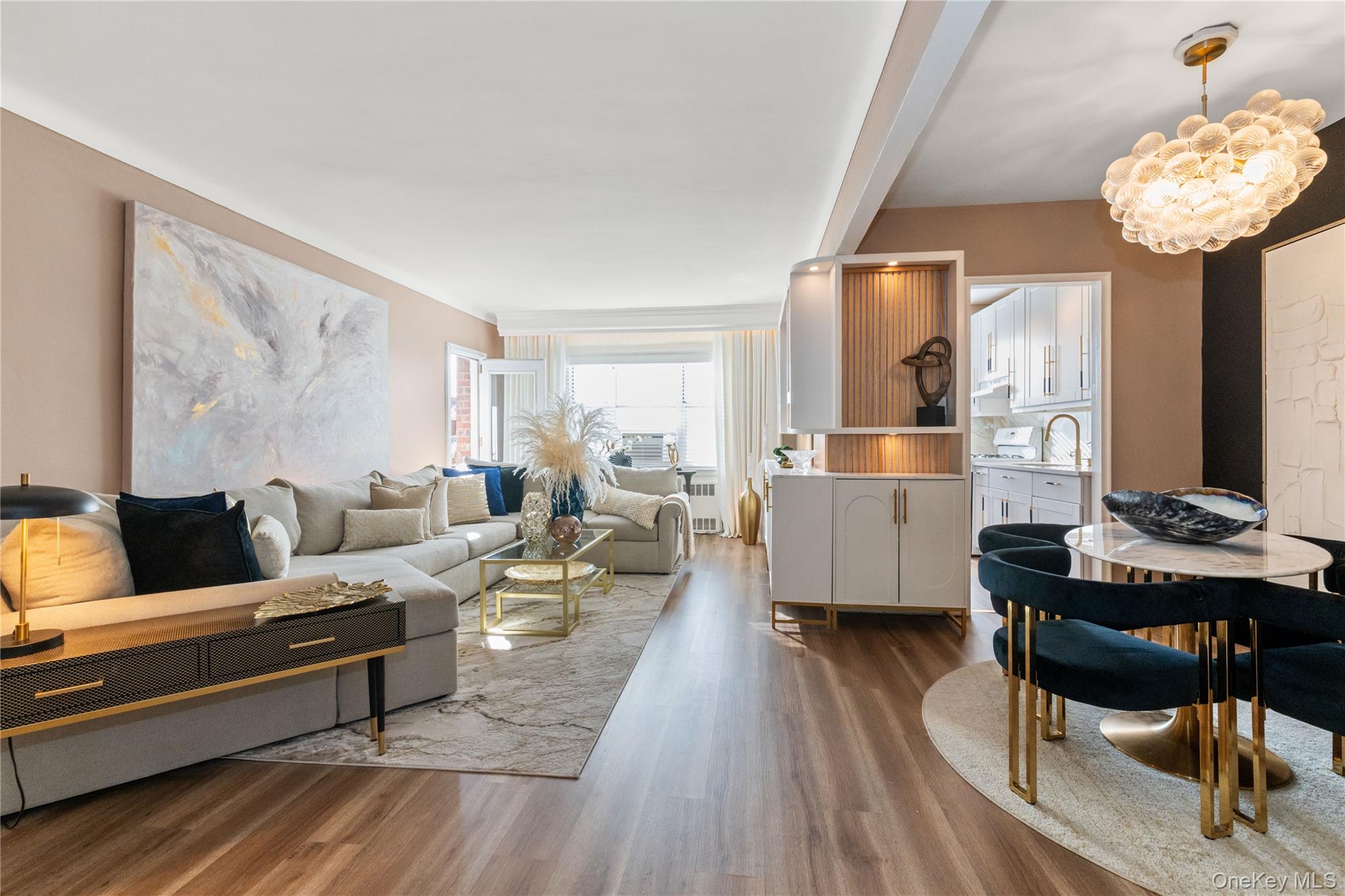 83-33 Austin Street, Unit 3D Queens, NY 11415 - Photo 3 of 20 a living room with furniture and a chandelier