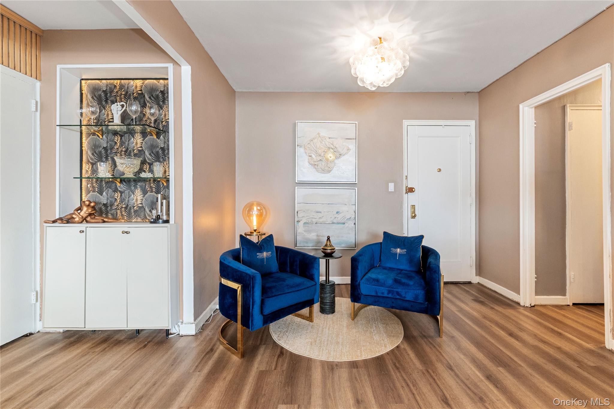83-33 Austin Street, Unit 3D Queens, NY 11415 - Photo 9 of 20 a living room with furniture and a wooden floor
