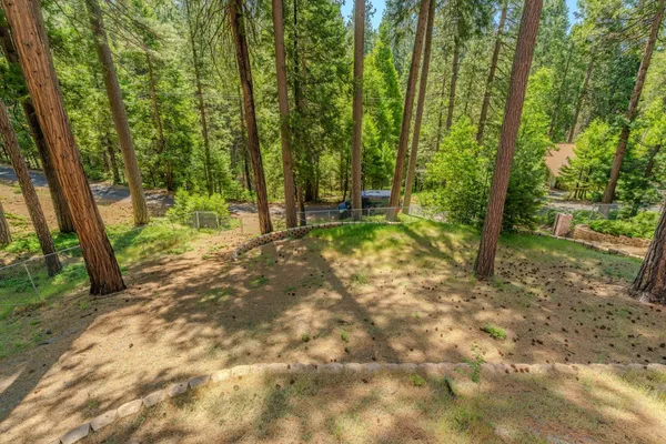 a bedroom with a bed and a table with wooden floor