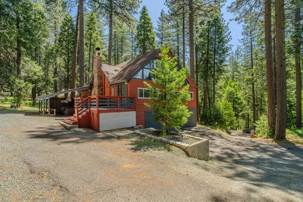 a view of balcony with wooden floor and outdoor seating