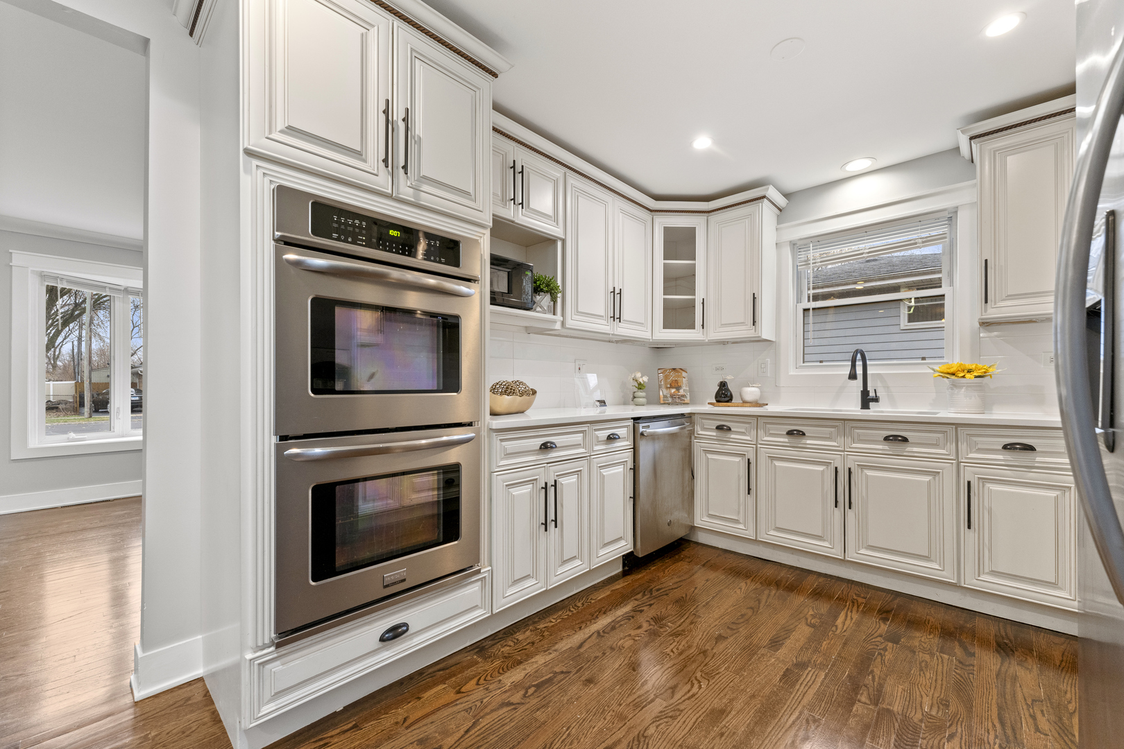 8306 South 82nd Avenue Justice, IL 60458 - Photo 11 of 40 a kitchen with granite countertop cabinets stainless steel appliances and a counter space