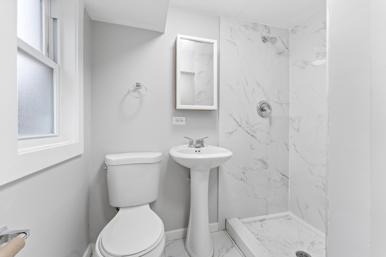 8306 South 82nd Avenue Justice, IL 60458 - Photo 30 of 40 a bathroom with a sink a toilet and shower