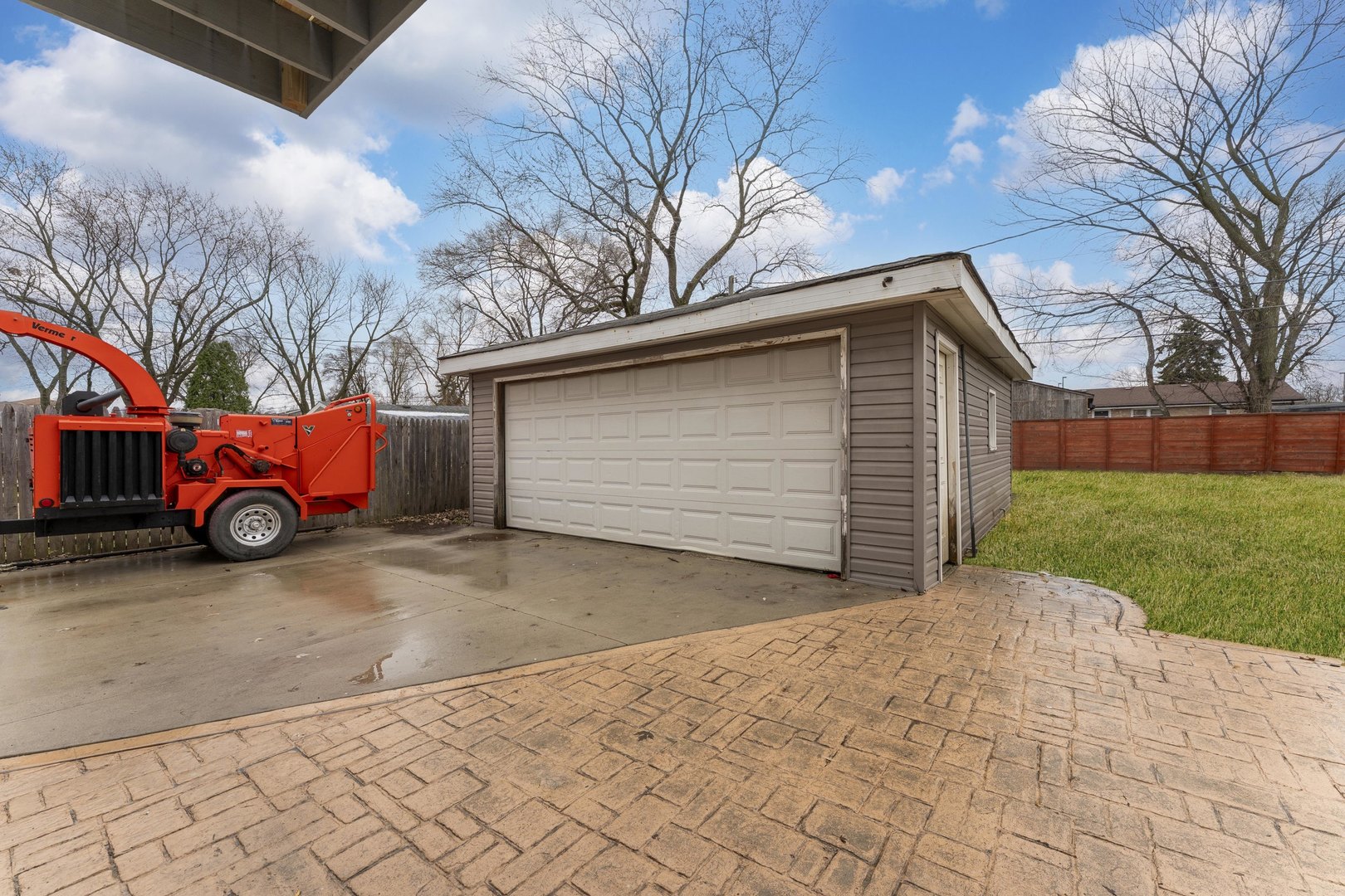 8306 South 82nd Avenue Justice, IL 60458 - Photo 34 of 40 a front view of a house with a yard and garage