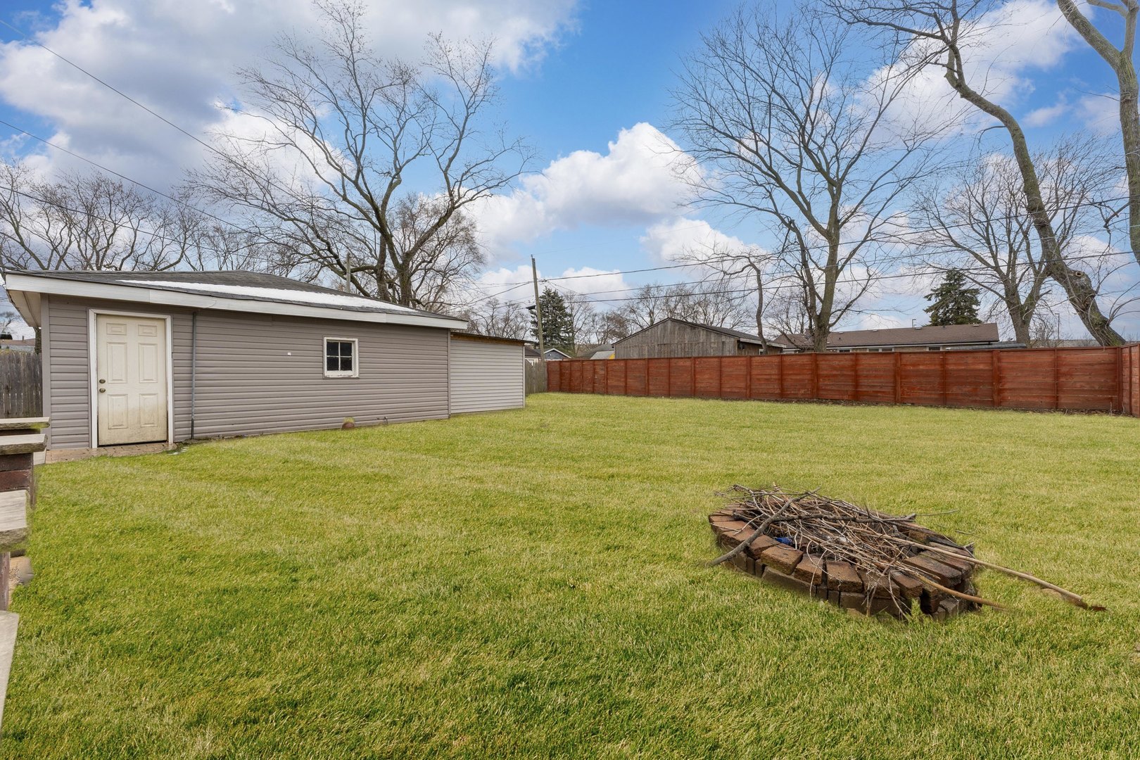 8306 South 82nd Avenue Justice, IL 60458 - Photo 35 of 40 a backyard of a house with lots of green space
