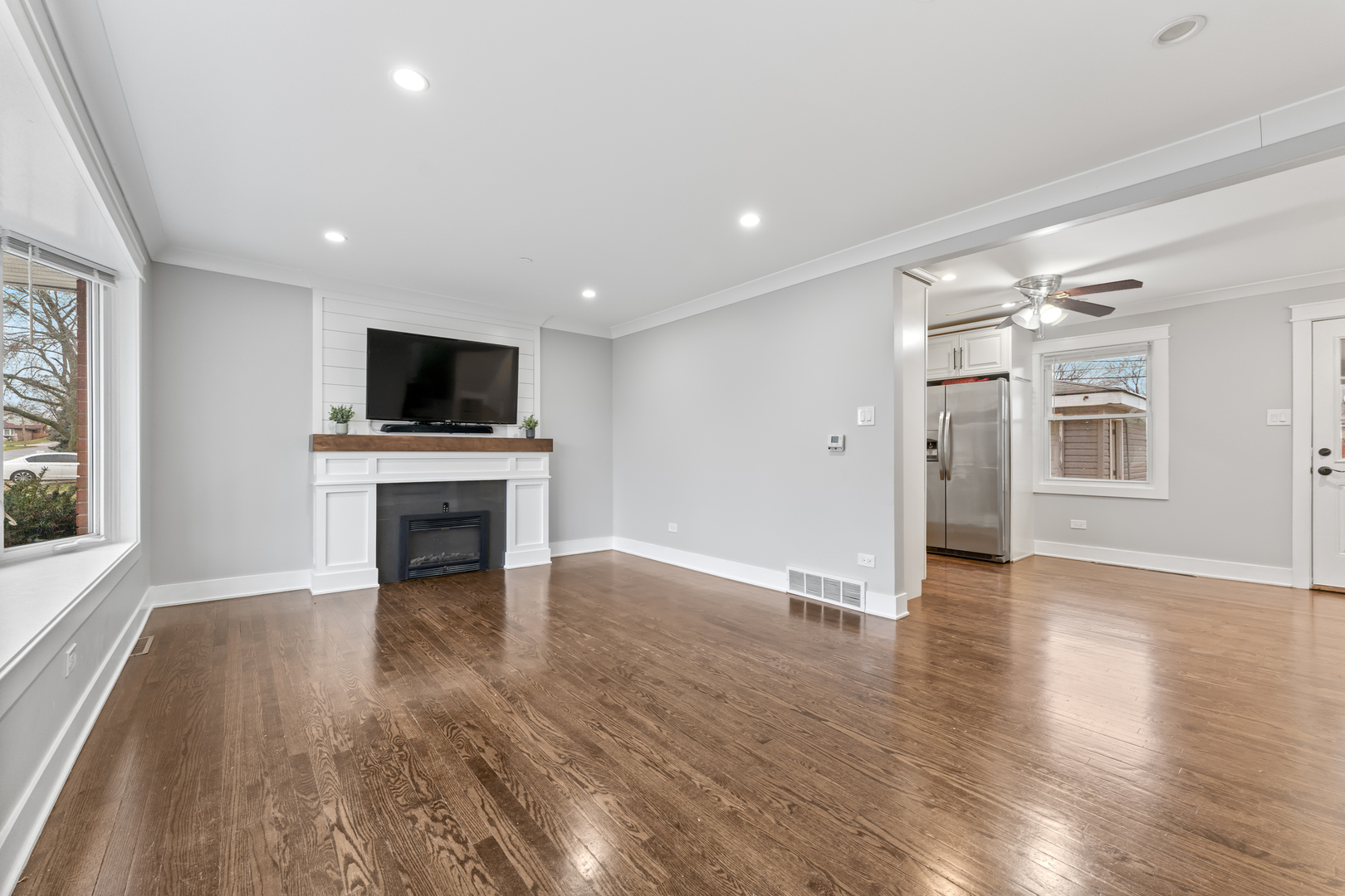 8306 South 82nd Avenue Justice, IL 60458 - Photo 4 of 40 a view of a livingroom with wooden floor and a fireplace