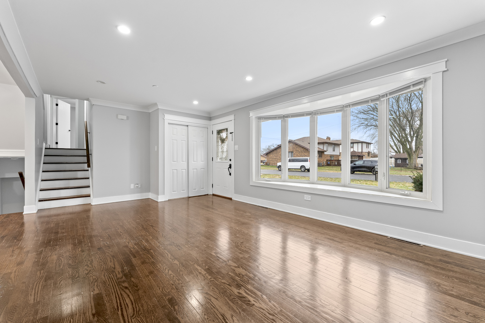 8306 South 82nd Avenue Justice, IL 60458 - Photo 6 of 40 an empty room with wooden floor and windows